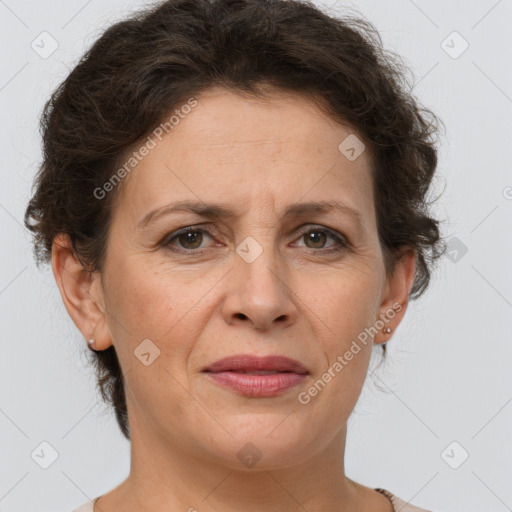 Joyful white adult female with short  brown hair and brown eyes