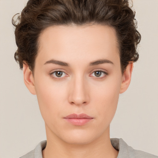 Neutral white young-adult female with short  brown hair and brown eyes