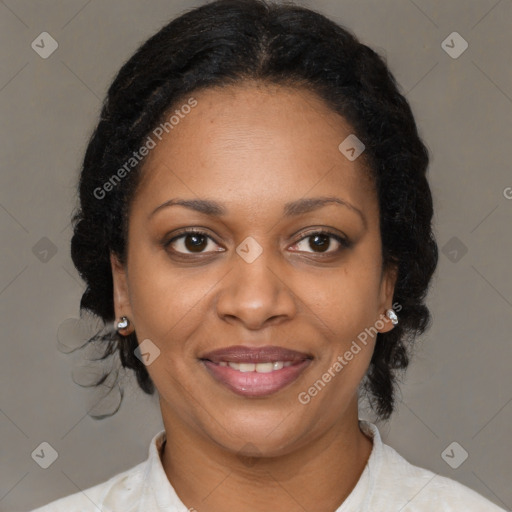 Joyful black adult female with medium  brown hair and brown eyes