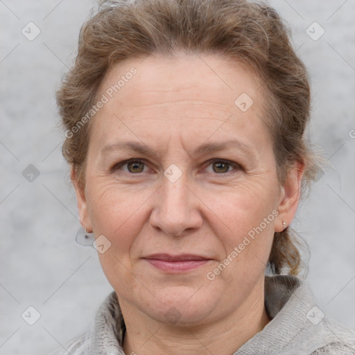 Joyful white adult female with medium  brown hair and grey eyes