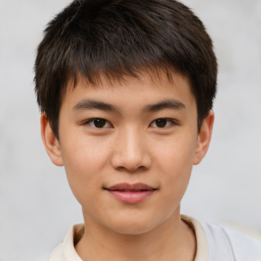 Joyful white child male with short  brown hair and brown eyes