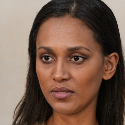 Neutral black young-adult female with long  brown hair and brown eyes