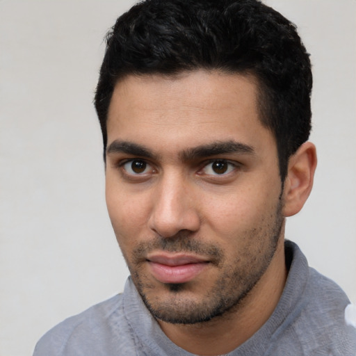 Neutral white young-adult male with short  black hair and brown eyes