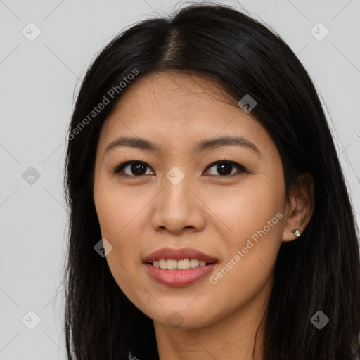 Joyful asian young-adult female with long  black hair and brown eyes