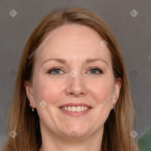 Joyful white adult female with long  brown hair and grey eyes