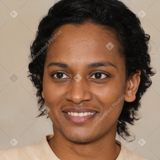 Joyful black young-adult female with medium  black hair and brown eyes