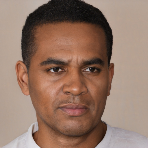 Neutral black young-adult male with short  black hair and brown eyes