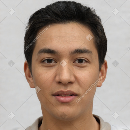 Joyful asian young-adult male with short  brown hair and brown eyes