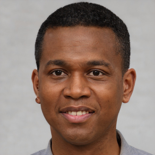 Joyful latino adult male with short  black hair and brown eyes