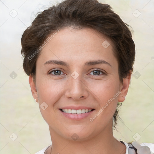 Joyful white young-adult female with short  brown hair and brown eyes