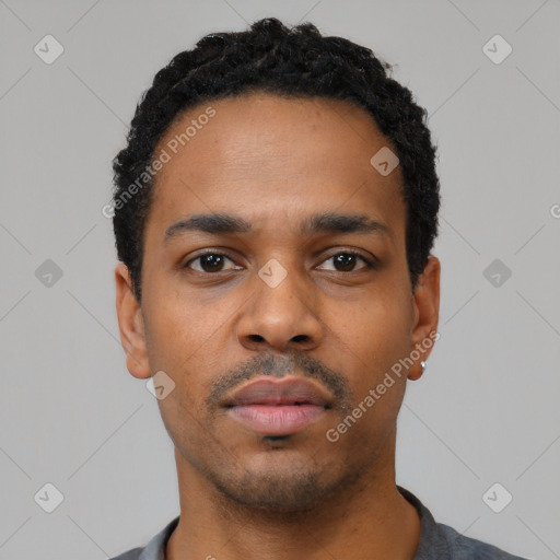 Neutral black young-adult male with short  black hair and brown eyes