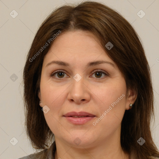 Joyful white adult female with medium  brown hair and brown eyes