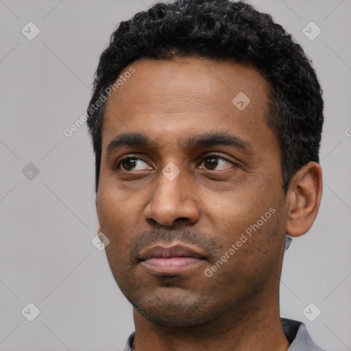 Neutral latino young-adult male with short  black hair and brown eyes