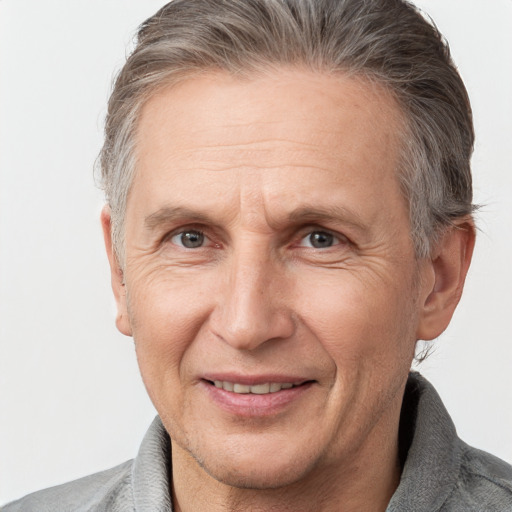 Joyful white middle-aged male with short  brown hair and brown eyes