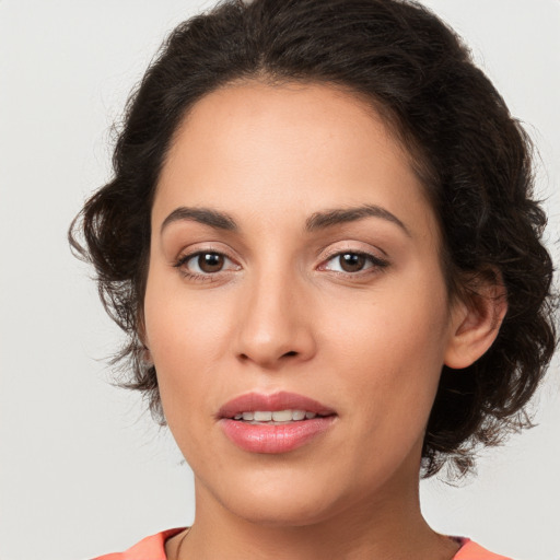 Joyful white young-adult female with medium  brown hair and brown eyes