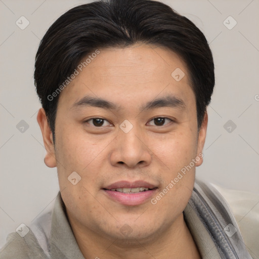 Joyful asian young-adult male with short  brown hair and brown eyes