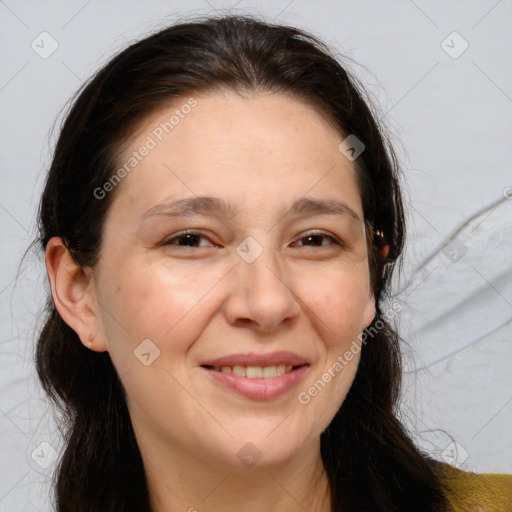 Joyful white adult female with long  brown hair and brown eyes