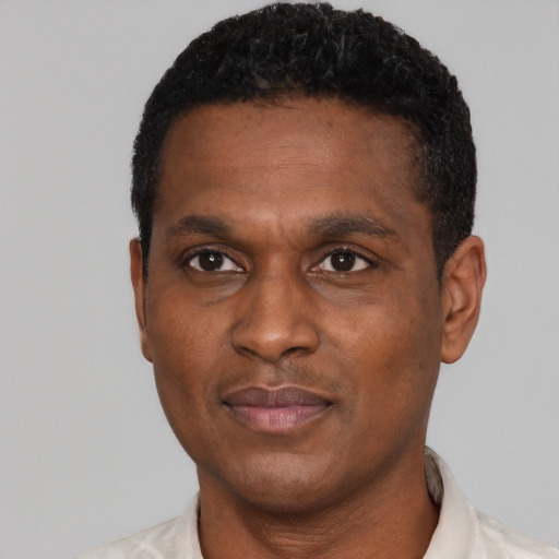Neutral latino adult male with short  black hair and brown eyes