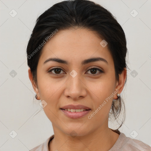 Joyful latino young-adult female with medium  brown hair and brown eyes