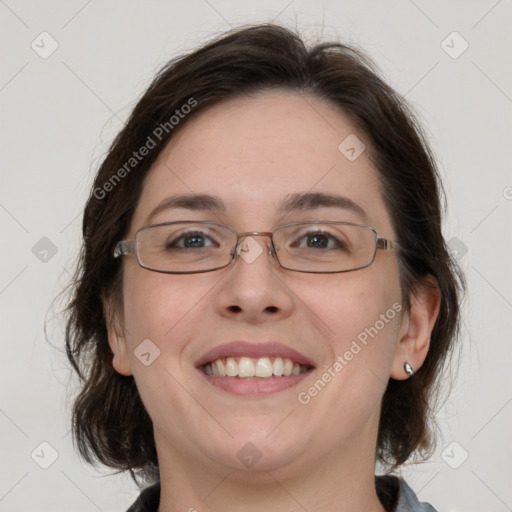 Joyful white adult female with medium  brown hair and grey eyes