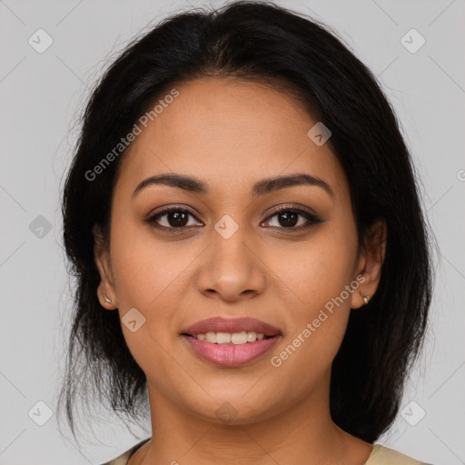 Joyful latino young-adult female with medium  brown hair and brown eyes