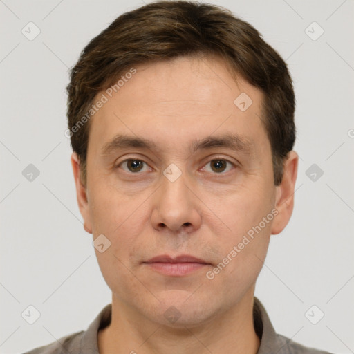 Joyful white adult male with short  brown hair and grey eyes