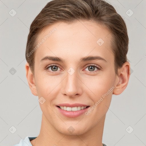 Joyful white young-adult female with short  brown hair and grey eyes