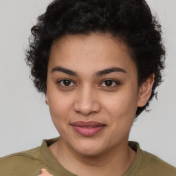 Joyful latino young-adult female with short  brown hair and brown eyes