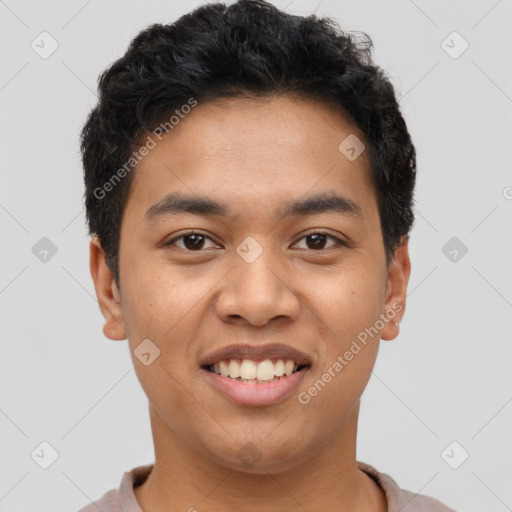 Joyful latino young-adult male with short  black hair and brown eyes