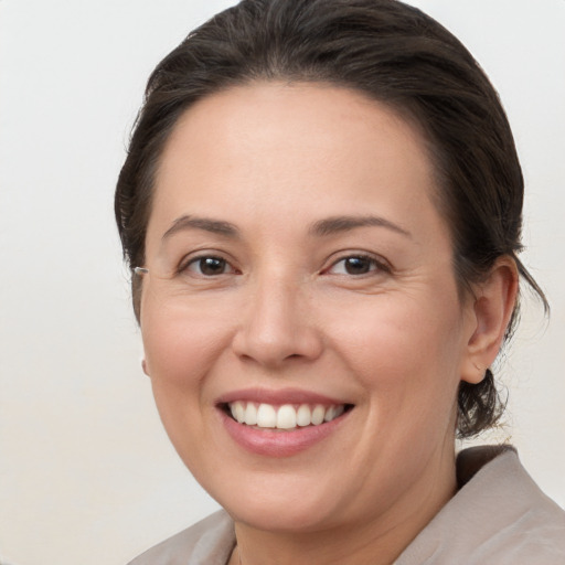 Joyful white young-adult female with medium  brown hair and brown eyes