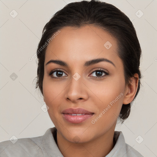 Joyful latino young-adult female with medium  brown hair and brown eyes