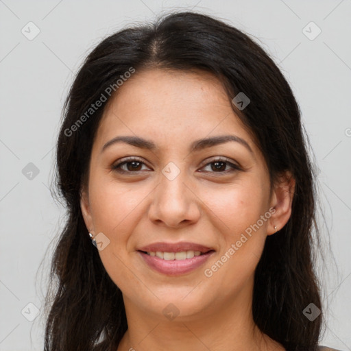 Joyful latino young-adult female with long  brown hair and brown eyes