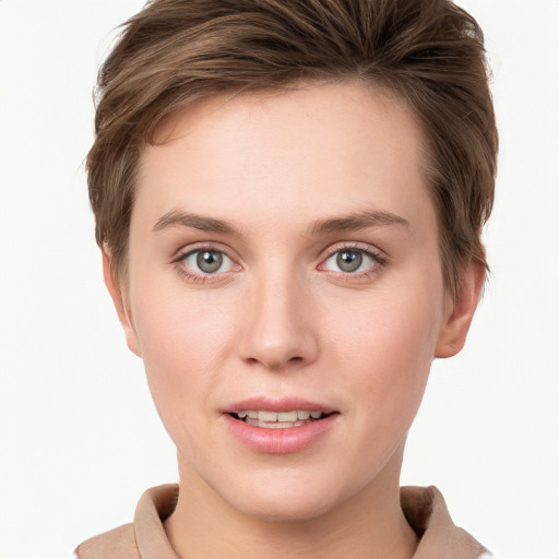 Joyful white young-adult female with short  brown hair and blue eyes