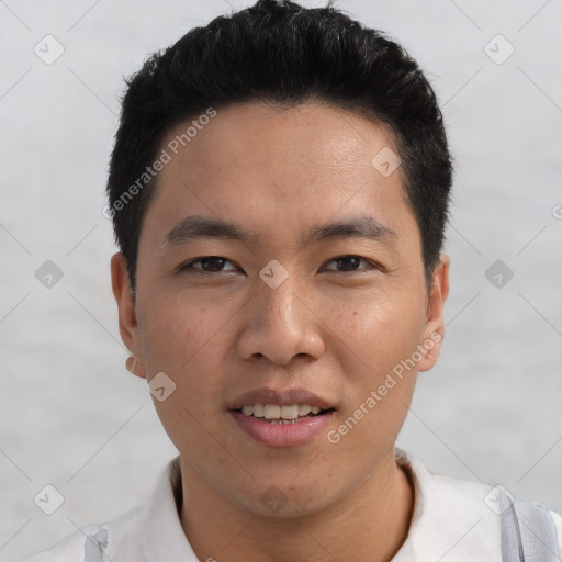 Joyful asian young-adult male with short  black hair and brown eyes