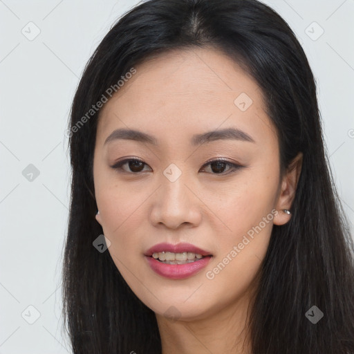 Joyful asian young-adult female with long  black hair and brown eyes