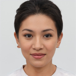 Joyful asian young-adult female with short  brown hair and brown eyes