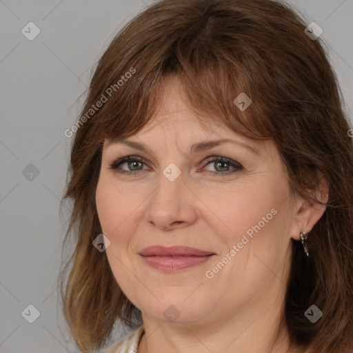 Joyful white adult female with medium  brown hair and brown eyes