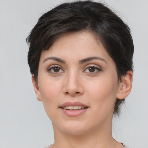 Joyful white young-adult female with short  brown hair and brown eyes