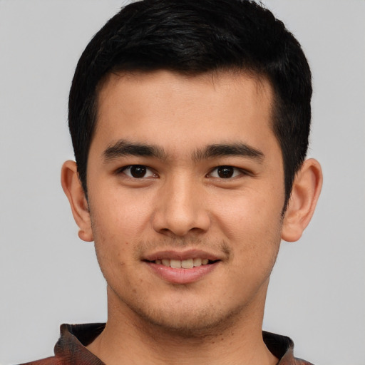 Joyful asian young-adult male with short  black hair and brown eyes