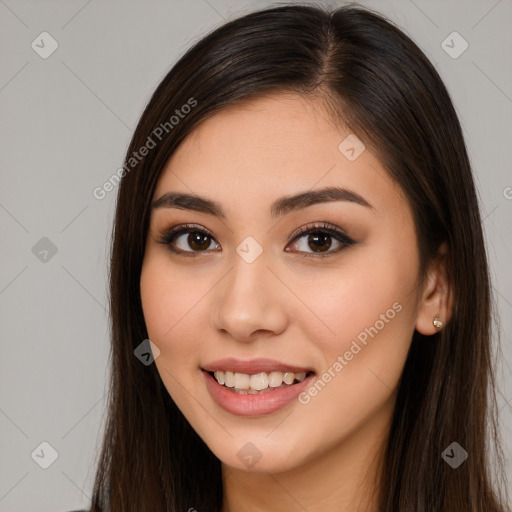 Joyful white young-adult female with long  brown hair and brown eyes