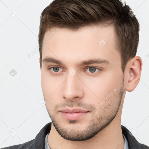 Neutral white young-adult male with short  brown hair and brown eyes