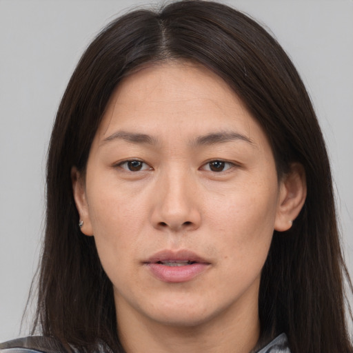 Neutral asian young-adult female with long  brown hair and brown eyes