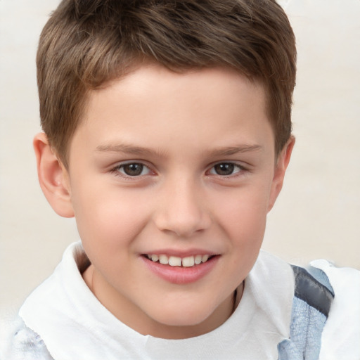 Joyful white child male with short  brown hair and brown eyes