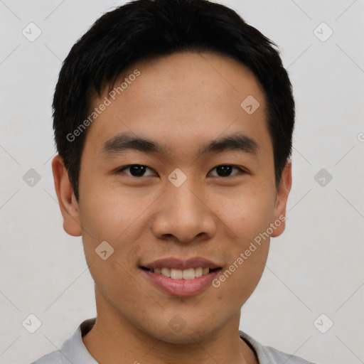 Joyful asian young-adult male with short  black hair and brown eyes