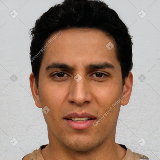 Joyful white young-adult male with short  black hair and brown eyes