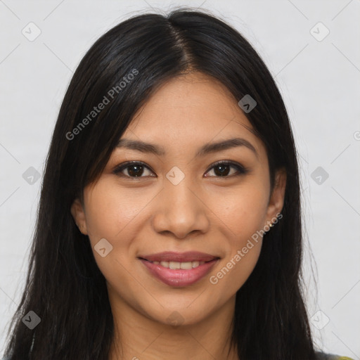 Joyful latino young-adult female with long  brown hair and brown eyes