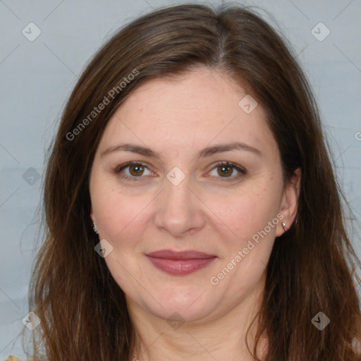 Joyful white adult female with long  brown hair and brown eyes