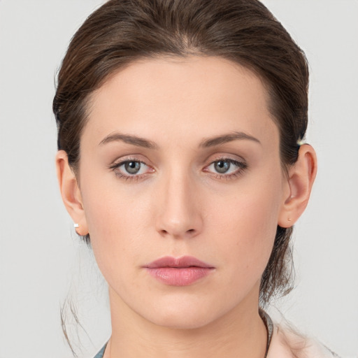 Neutral white young-adult female with medium  brown hair and grey eyes