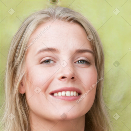 Joyful white young-adult female with long  brown hair and blue eyes