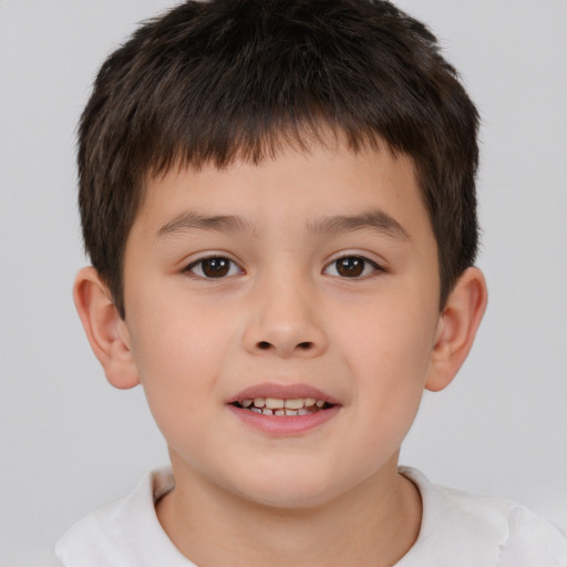 Joyful white child male with short  brown hair and brown eyes